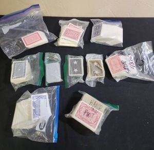lot 445 image: Playing Card Collection - several bagged lots of playing cards.  Some have multiple matching decks.  A couple are labeled for Hand & Foot game.
