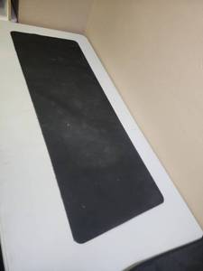 lot 453 image: Large Full Desk Black Mouse Pad - has one small spot where the material is very slightly frayed.  Needs cleaned.  Has felt bottom for protecting desk.