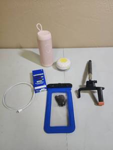 lot 461 image: Onn Lightning Charger Cable new in box, Water Proof Cell Phone bag in new condition, Selfie-Stick, bathroom bluetooth speaker and a pink portable speaker