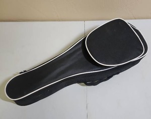 lot 448 image: Small string instrument case (maybe for a Ukulele, too small for a violin), includes a Snark Clip-On Guitar Tuner and a thick pick