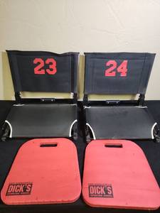 lot 479 image: Stadium Seats with Numbers 23-24 - overall good condition, light dirt on backs.  And 2 Dicks foam pads
