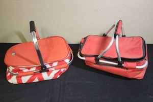 lot 480 image: Two Insulated collapsible picnic baskets - both need cleaned outside, red one has heavier dirt.  Red one has some rips in the insulation inside, Coral pattern one needs a screw for the handle