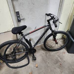 lot 488 image: Schwinn StandPoint Large Frame Mountain Bike - needs new tire tubes (back tube sticking out of tire) and a new chain, potentially other light maintenance needed