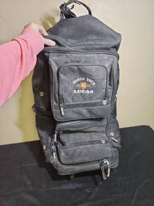 lot 490 image: Very large World Tour Lucas Black Duffle Bag - has minor damage on the side handle and to the handle protector on the top - has extending handle and 2 wheels - very clean inside, but has dirt outside