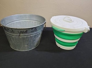 lot 512 image: Galvanized Metal Tub (has the words Watch Your Step written on it in permanent marker and Collapsible Bucket with locking lid and handle