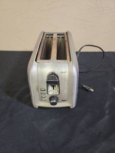 lot 657 image: Oster Stainless Steel 2-Slice Toaster - needs a good clean inside and out