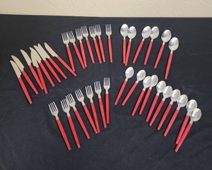 lot 674 image: Stainless Steel Flatware Set with Red Handles