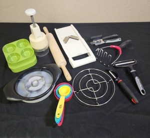 lot 688 image: Kitchen Gadgets - egg cooker, chopper, wood rolling pin, potato masher, cheese cutter, can opener and more