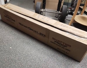 lot 586 image: Large box with Mix of Used and New Commercial Light Bulbs - were known to be last working bulbs T8 48 (ballasts on light fixtures had gone out)