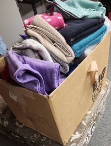 lot 587 image: Large box of rags - includes several towels,  hand towels and wash cloth size.  Many have bleach stains, all are clean