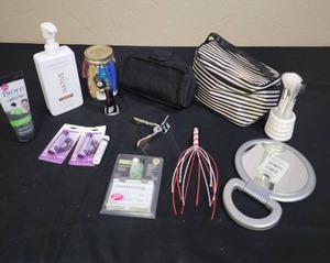 lot 718 image: Mixed Beauty and Personal Care Items Lot - Shampoo, face wash, chap stick, manicure set, eyelash curler, travel bags, head scratcher tool and more