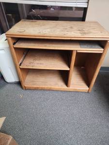 lot 309 image: Oak Computer Desk with pull out drawer - has writing on it.  Needs refinished.   Very sturdy.  Measures  37W x 19 D x 30.5 H