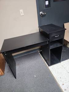 lot 310 image: Black Wood Laminate Computer or Student Desk - measures 44W x 19.5 D x 27.5 H on the main part, 32 H on shelf - has one drawer.  In very good condition, just dusty and needs a good cleaning
