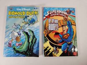 lot 172 image: Disney & DC Comics Small Paperback Book Collection - Donald Duck and Superman Adventures