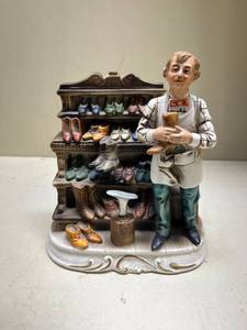 lot 476 image: Ceramic Shoemaker Figurine with Display Shelf
