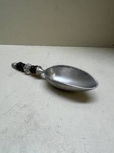 lot 494 image: Pewter Serving Spoon with Decorative Handle Middle Glass has Manganese Glow under 365nm