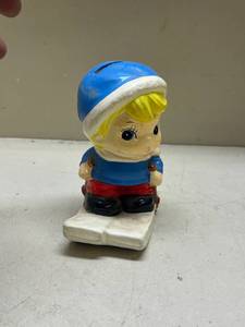 lot 536 image: Skiing Child Coin Bank Ceramic Figurine