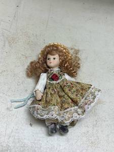 lot 549 image: Porcelain Doll with Curly Hair and Floral Dress