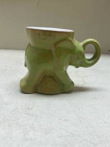 lot 559 image: Frankoma 1981 Green Elephant Shaped Ceramic Coffee Mug