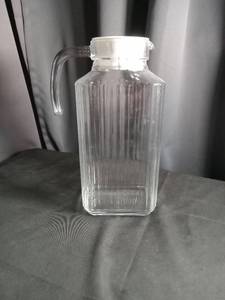 lot 2349 image: Luminarc Glass Water Bottle with White Cap