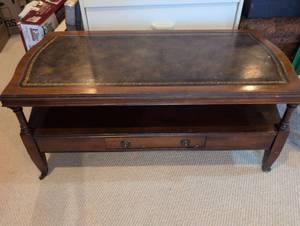Traditional Mahogany Coffee table with Leather Top on casters with lower center drawer