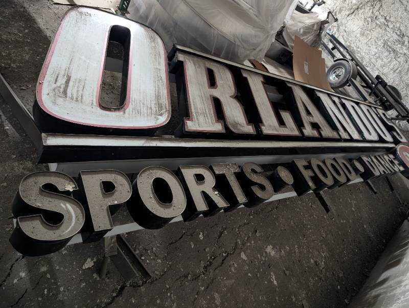 lot 1021 image: Kansas City Vintage 1990s Orlando Sports Food Dance Commercial Sign Outside Building  20 feet long