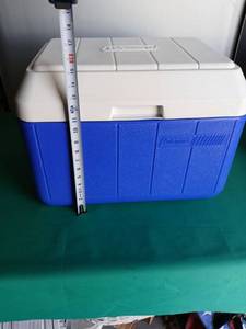 lot 9121 image: Coleman Portable Ice Cooler with Water Jugs