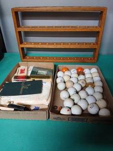 lot 9136 image: Golf Ball Collection with Wooden Display Rack and Golf Accessories - Retail $25