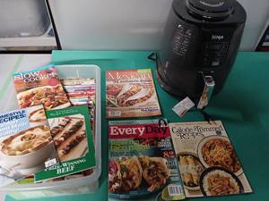 lot 9193 image: Ninja Multi-Cooker with Recipe Magazine Collection - Powers Up - Needs a good cleaning