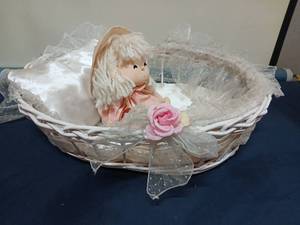 lot 9515 image: Decorative Doll in Wicker Basket with Fabric Liner