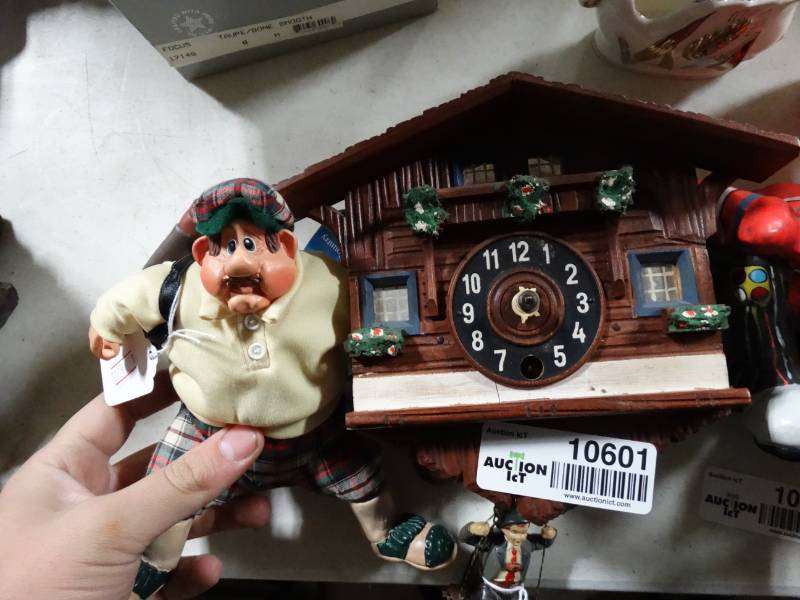 lot 10601 image: Cuckoo Clock and Golfer Decoration