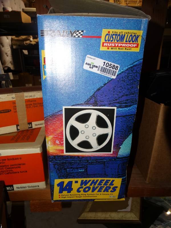 lot 10588 image: 4 Pack of 14 in. Wheel Covers