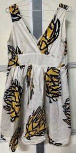 lot 5682 image: Free Style Tropical Print Cutout Mini Dress featuring a vibrant yellow, black, and white abstract palm leaf graphic motif (XL)