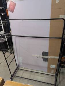 lot 74 image: Double Bar Metal Clothing Rack with Wheels  - Retail $50