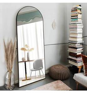 lot 16456 image: OGCAU Full Length Mirror, 70x26 Arched Full Body Floor Mirror with Stand, Hanging or Leaning, Standing, Wall Mounted with Aluminum Frame for Bedroom Living Room (Black) - Retail $99