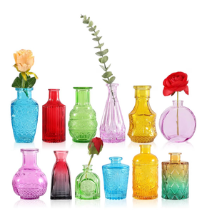 lot 2102 image: Small Bud Vases, Vintage Clear Glass Bud Vases in Bulk with Unique Embossed Patterns for Wedding Centerpieces, Table Decor, Rustic Party Reception Decorations (Colorful-12pcs)