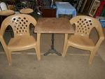 Tan Plastic Chairs and Iron Base Table