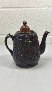 lot 13 image: Brown Glazed Relief Scene Teapot