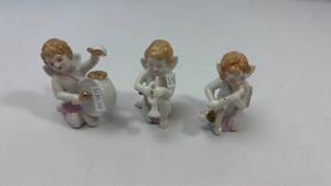 lot 70 image: Porcelain Musical Cherub Figurines Set