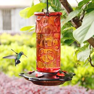 lot 1121 image: Juegoal 28 oz Glass Hummingbird Feeders for Outdoors, Wild Bird Feeder with 5 Feeding Ports, Metal Handle Hanging for Outdoor Garden Tree Yard, Red - Retail $19