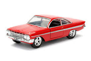 lot 20375 image: Jada Toys Fast & Furious 132 scale die-cast replica of Doms red 1961 Chevrolet Impala - Retail $0