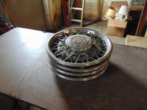 lot 3823 image: 4 Cadillac Hub Caps - See Pictures for scrapes on one