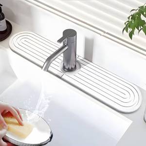 lot 16449 image: Diatomite Faucet Mat for Kitchen Sink - 23.6L Fast Drying Stone Splash Guard, Super Absorbent Water Absorbing Tray, Prevents Moisture Buildup for Bathroom Countertop (White)