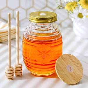 lot 11886 image: Kate Aspen 24oz. Bee Hive Shaped Honey Glass Mason Jar with Two Wooden Honey Dippers, Bamboo and Metal Lid, Kitchen Decor, Bumblebee Baby Shower Prize, Take Home Gift, Bee Decorations