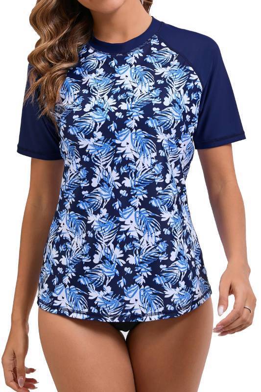 lot 4927 image: Halcurt Womens Short Sleeve Rash Guard Swimsuit Top with Built in Bra Swim Shirt UPF50 Quick Dry Bathing Suit Navy Leaf XL - Retail $30