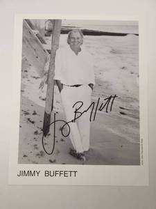 lot 120 image: Jimmy Buffett Signed Beach Photograph