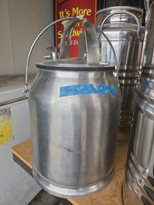 lot 15651 image: McCormick-Deering Aluminum Milk Can