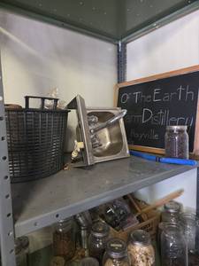 lot 15708 image: Contents of Shelf Including Glasses, Printed Labels, Corks and More