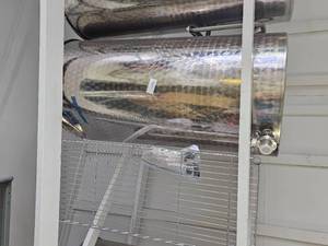 lot 18583 image: Damaged 100 Gallon Stainless Steel Tank W Stand and Valve