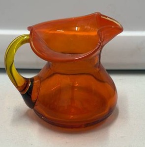 lot 59007 image: Orange Glass Pitcher with Yellow Handle (small) - Retail $15